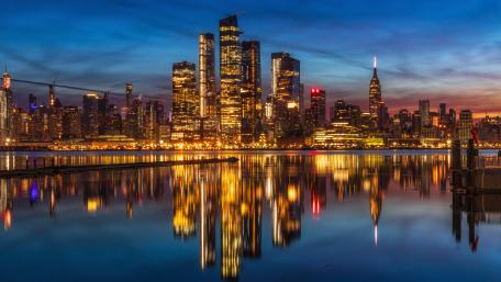 City Lights Reflect on Tranquil Waters wallpaper