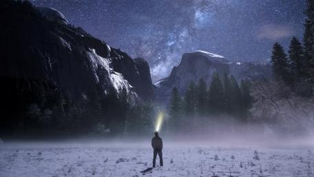 Man with headlight at Yosemite Valley wallpaper