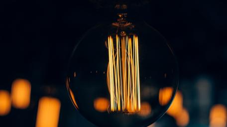 Warm Glow of Vintage Light Bulb Wallpaper wallpaper