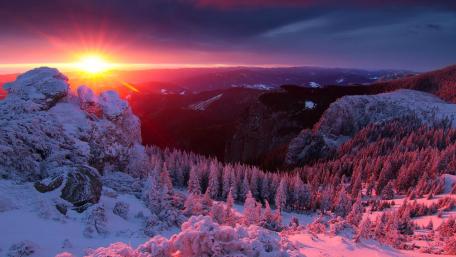Winter Sunrise Over Snowy Mountains wallpaper