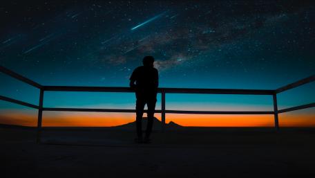 man in dark wallpaper