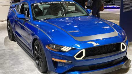 High-Performance Blue Mustang on Display wallpaper