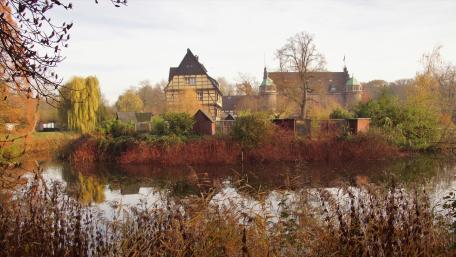 Moated castle in autumn wallpaper
