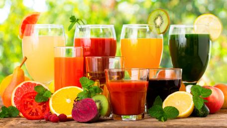 Vibrant Fruit Juices Display in 4K Quality wallpaper