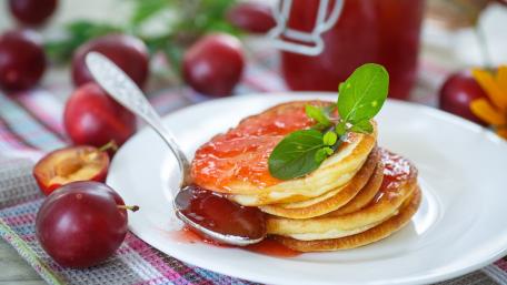 Delicious Pancakes with Fruit Jam and Plums wallpaper