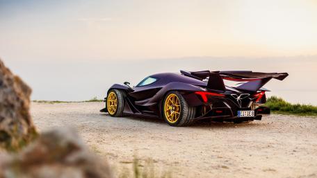 Sleek Supercar Enjoying Sunset Serenity wallpaper