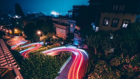 Luminous Night Cityscape with Winding Roads wallpaper