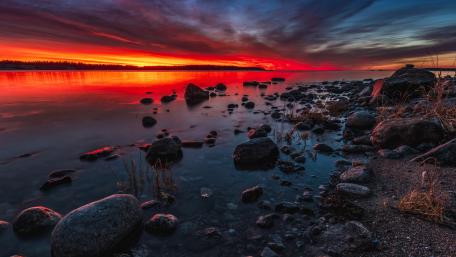 Fiery Skyline Caresses Tranquil Waters wallpaper