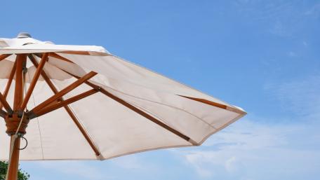 Sunny Day Under a Blue Sky with Umbrella wallpaper