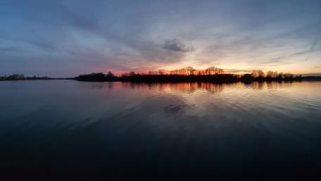 Sunset over the river in the evening wallpaper