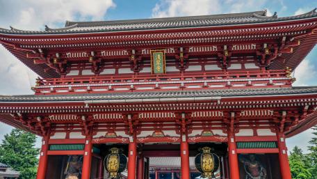 Vibrant Temple Entrance in Urban Setting wallpaper