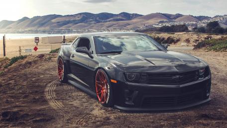 Sleek Sports Car by the Seaside wallpaper