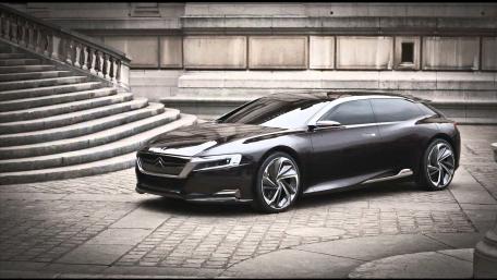 Sleek Modern Car Design in Urban Setting wallpaper