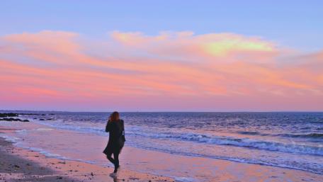 Serene Sunset Walk by the Ocean Coastline wallpaper
