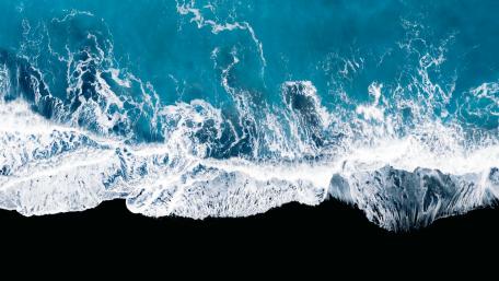 Aerial Ocean Dance in Blue and White wallpaper