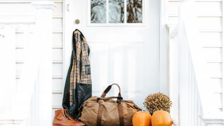 Autumn Doorway Charm with Pumpkins and Bags wallpaper