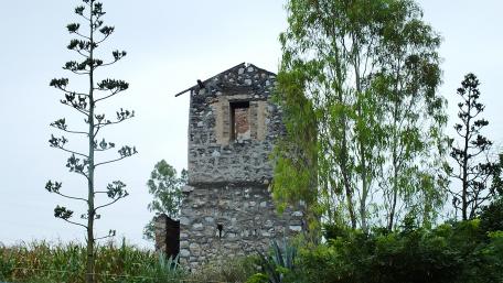Ancient Stone Tower in Rural Landscape wallpaper