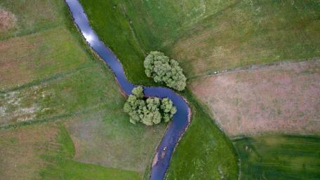 Serene Aerial View of a Meandering River wallpaper