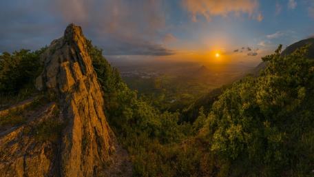 Majestic Sunset Over a Serene Valley wallpaper