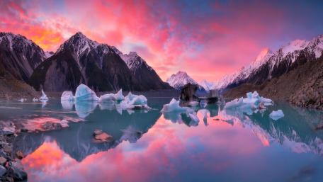 Serene Sunset Over Mountain Lake wallpaper