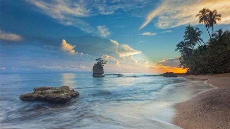 Serenity at the Beachside Monolith Scene wallpaper