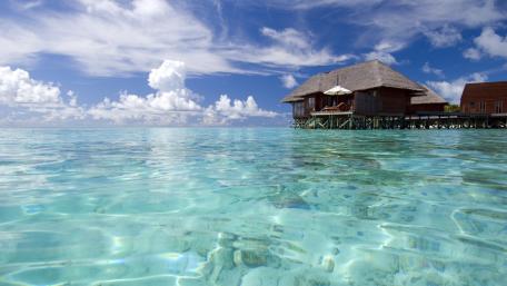 Tranquil Overwater Bungalow in Tropical Paradise wallpaper