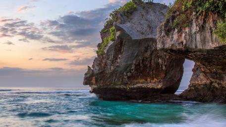 Natural Sea Arch Beneath a Serene Sky wallpaper