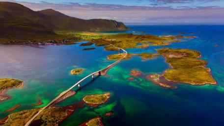 Scenic Norwegian Bridge Over Vibrant Waters wallpaper