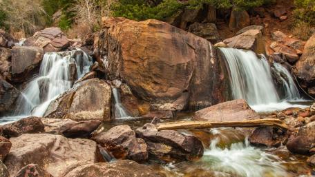 Serene Beauty of Flowing Waterfalls wallpaper