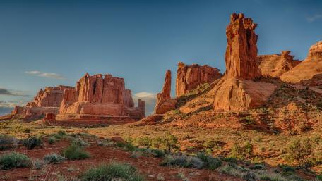 Majestic Desert Buttes Under a Golden Sky wallpaper
