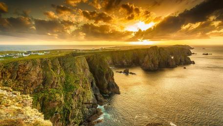 Majestic Sunset Over Rugged Cliffs wallpaper