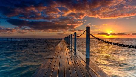 Serene Sunset Over Tranquil Pier Mindfully Captured wallpaper