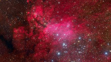 Stunning Red Nebula Under Starry Sky wallpaper