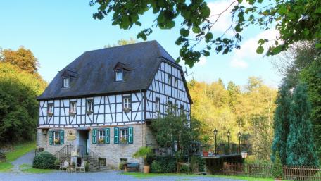 Charming Half-Timbered House in Serene Countryside wallpaper