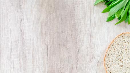 Fresh Bread and Greenery on Rustic Wood Planks wallpaper