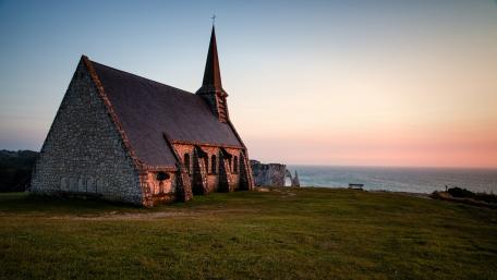 Serene Church by the Sea at Sunset wallpaper