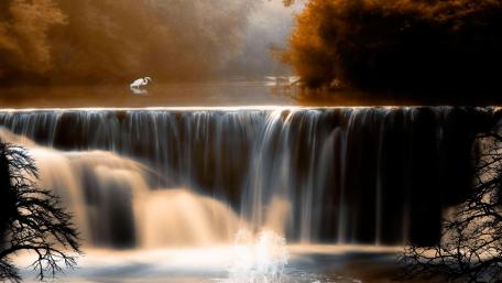 Serene Waterfall Amidst a Mystical Landscape wallpaper