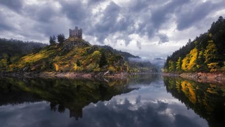 Majestic Castle Surrounded by Nature's Beauty wallpaper