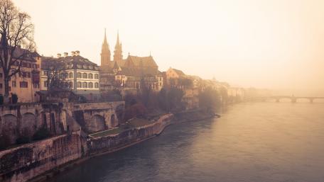 Misty River Scene in Charming Cityscape wallpaper