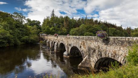 Serene Stone Bridge Over Tranquil Waters wallpaper