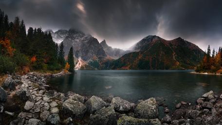 Majestic Mountain Lake Under a Dramatic Sky wallpaper