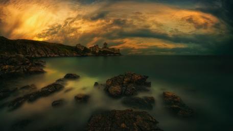 Mystical Twilight Over Castle Shoreline wallpaper