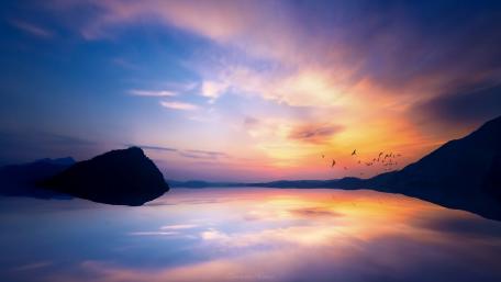 Serene Sunset with Reflections in Tranquil Waters wallpaper