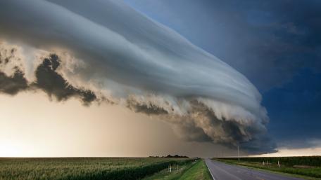 Majestic Storm Clouds Over the Open Road wallpaper