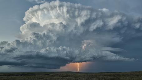 Majestic Storm Clouds with Lightning Flashing wallpaper