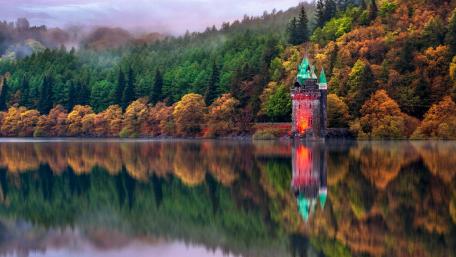 Autumn Castle Reflection on Serene Lake wallpaper