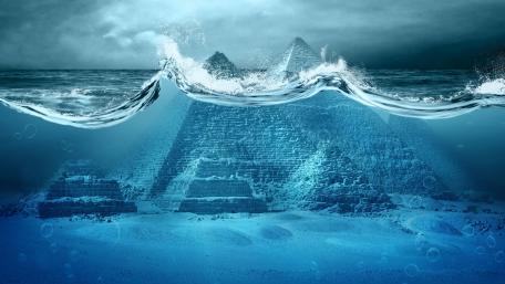 Mystical Underwater Pyramids Surrounded by Waves wallpaper