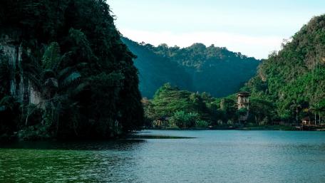 Serene Lake Amidst Lush Mountainside wallpaper