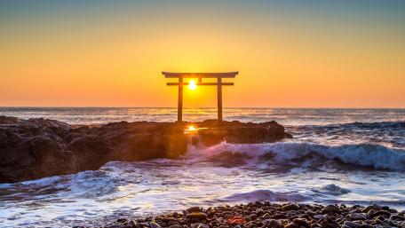 Serene Sunrise at the Coastal Torii Gate wallpaper
