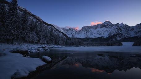 Serene Winter Landscape Reflecting Mountains wallpaper